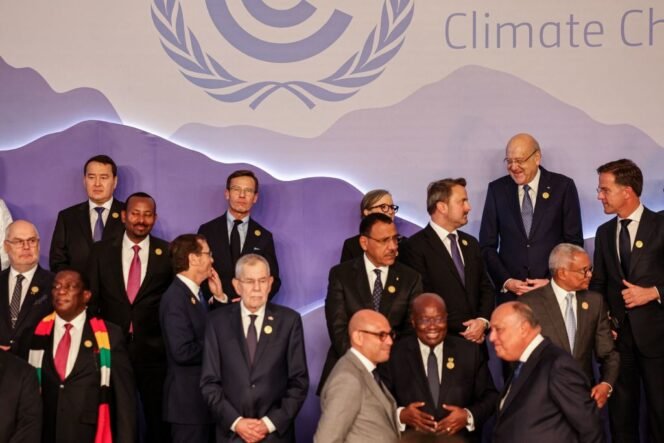 
					Ethiopia's Prime Minister Abiy Ahmed (4th-L), Israel's President Isaac Herzog (5th-L), Austria's President Alexander Van der Bellen (7th-L), Tunisia's Prime Minister Najla Bouden (C top behind), Lebanon's caretaker prime minister Najib Mikati (2nd-R), Dutch Prime Minister Mark Rutte (R), and other world leaders and officials gather during the group picture opportunity ahead of their summit at the COP27 climate conference, in Egypt's Red Sea resort city of Sharm el-Sheikh, on November 7, 2022. (Photo by AHMAD GHARABLI / AFP) (Photo by AHMAD GHARABLI/AFP via Getty Images)
